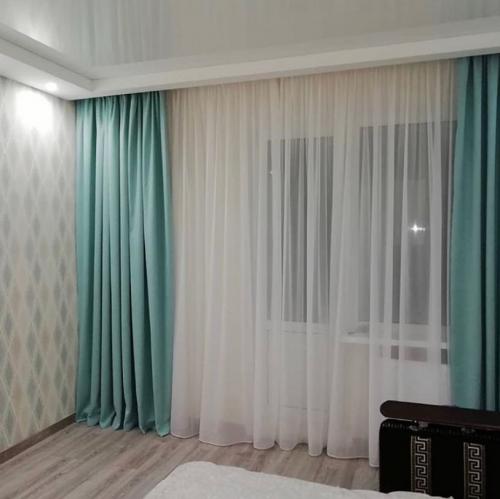 Как выбрать в гостиную красивую и современную тюль. Варианты драпировки тюля в гостиной 22 Как выбрать в гостиную красивую и современную тюль. Варианты драпировки тюля в гостиной 22